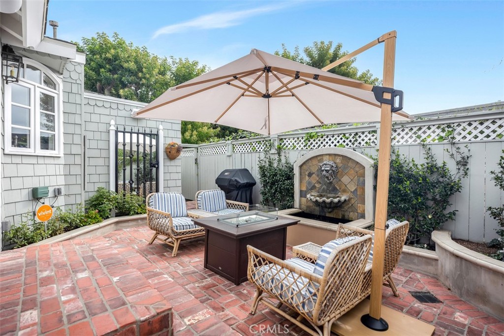 Relax by the outdoor fire pit with water feature and enjoy use of a BBQ. - 501 Lombardy Lane, Laguna Beach CA 92651 - photo 24