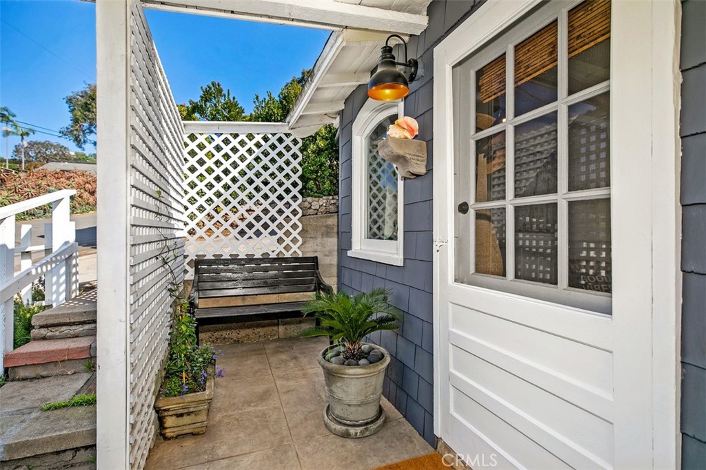 Front porch/patio area with stairs to the left coming from the driveway. - 509 Diamond Street, Laguna Beach CA 92651 - photo 2