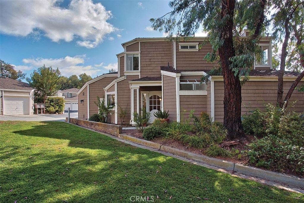 Plenty of privacy with no other neighbors 3/4 all around this end-unit townhouse. Feels like a single family residence! - 511 San Nicholas Court, Laguna Beach CA 92651 - photo 1