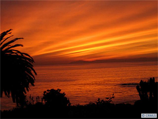 Catalina sunset from Living Room/patio - 520 CLIFF DRIVE 102, Laguna Beach CA 92651 - photo 1