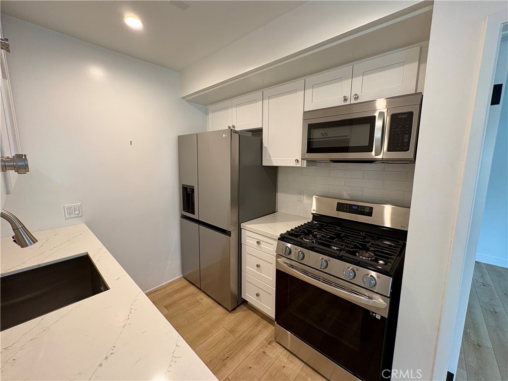 Kitchen featuring stainless appliances - 527 Catalina 2, Laguna Beach CA 92651 - photo 6