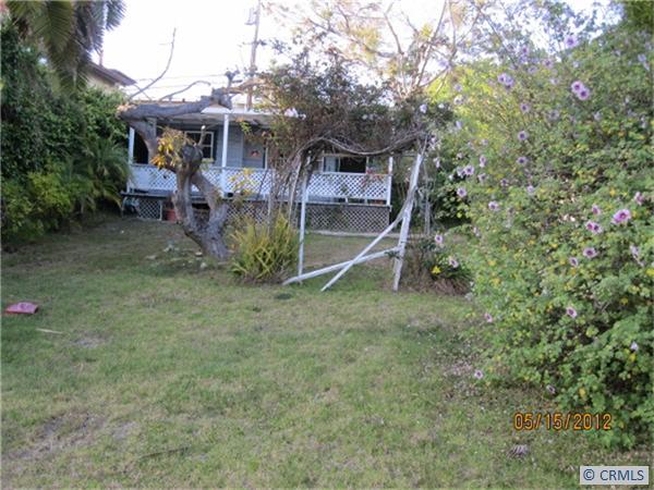 GRASSY LOT WITH COTTAGE IN THE BACKGROUND - 530 N COAST Highway, Laguna Beach CA 92651 - photo 1
