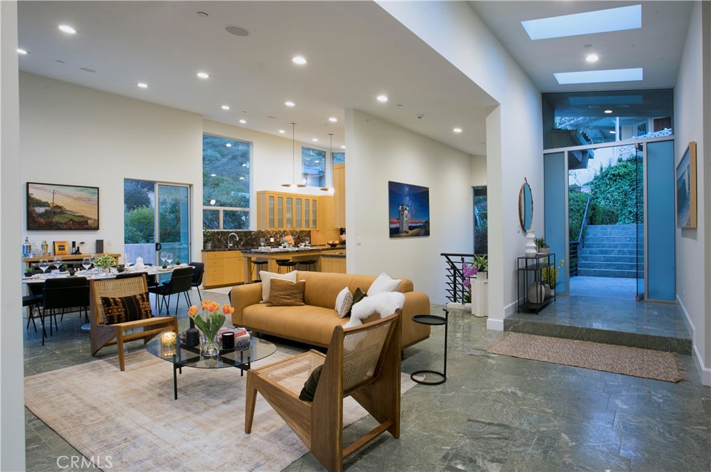 LITE AND BRIGHT ENTRYWAY WITH SKYLIGHTS ABOVE -LUXURIOUS FAMILY ROOM OPENS TO GOURMET KITCHEN - WRAP AROUND DECK WITH BU - 533 Temple Hills Drive, Laguna Beach CA 92651 - photo 3