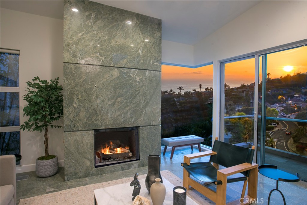 COZY FIREPLACE WITH OCEAN VIEWS OFF THE LIVING ROOM - 533 Temple Hills Drive, Laguna Beach CA 92651 - photo 6