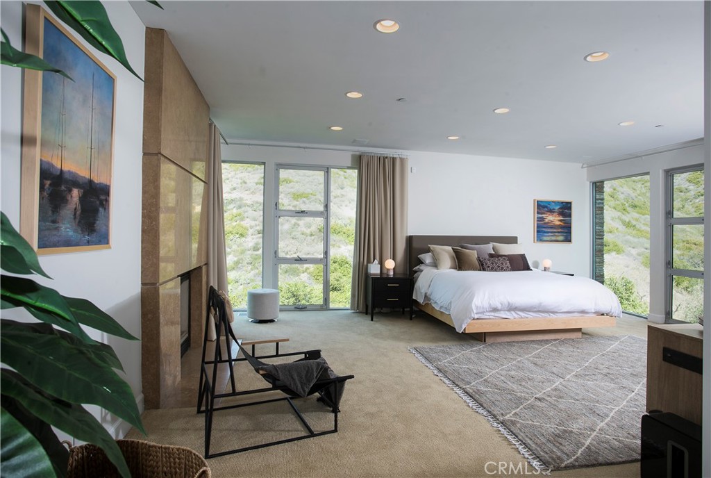 SPACIOUS MASTER BEDROOM WITH FIREPLACE AND DOUBLE WALKIN CLOSETS - 533 Temple Hills Drive, Laguna Beach CA 92651 - photo 15