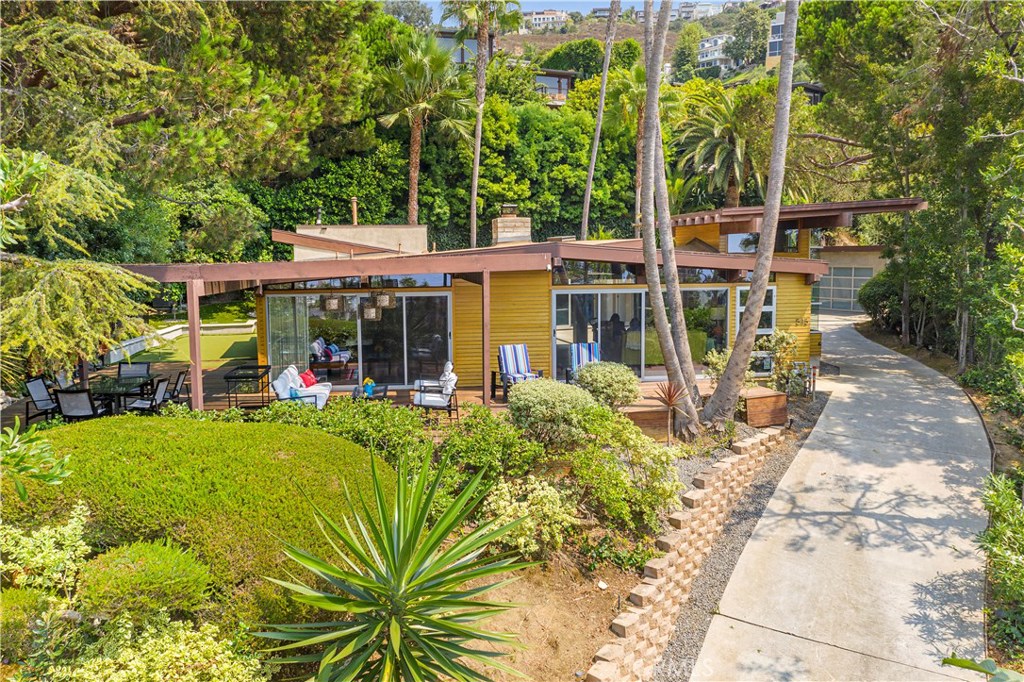 Wonderful mid century remodel where you can enjoy your privacy in this Shiplap sided home with attention to details! - 545 Center Street, Laguna Beach CA 92651 - photo 1