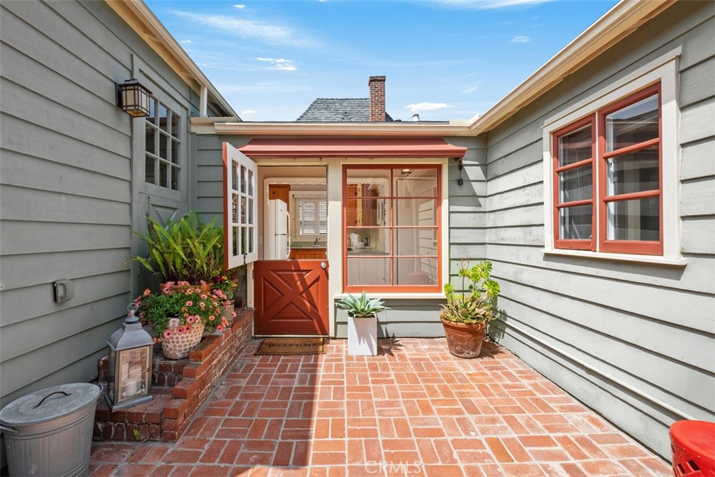 Enter the home thru a darling dutch door. - 551 Anita Street, Laguna Beach CA 92651 - photo 1