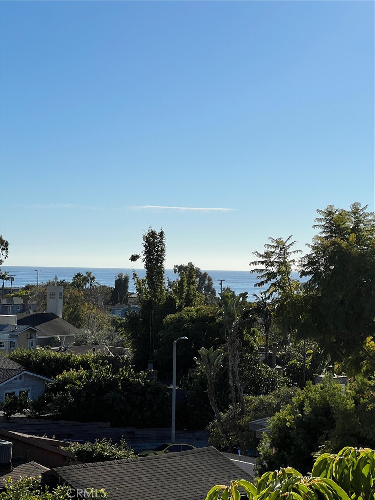 This quiet apartment has a distant ocean view. The foliage creates a fine setting. - 571 Blumont Street, Laguna Beach CA 92651 - photo 1