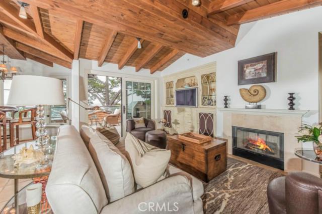 Living room fireplace; one in the master suite, too. - 576 Cliff Drive, Laguna Beach CA 92651 - photo 1