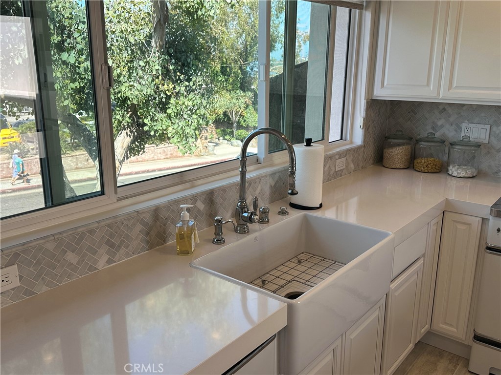 Farm style sink, decorative back-splash and new white cupboards - 577 Ramona B, Laguna Beach CA 92651 - photo 7