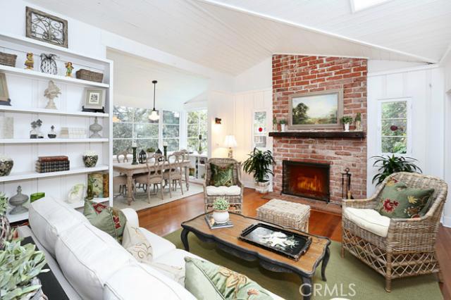 The ideal room to cozy up to the fireplace and read your favorite novel. - 586 St Anns Drive, Laguna Beach CA 92651 - photo 1