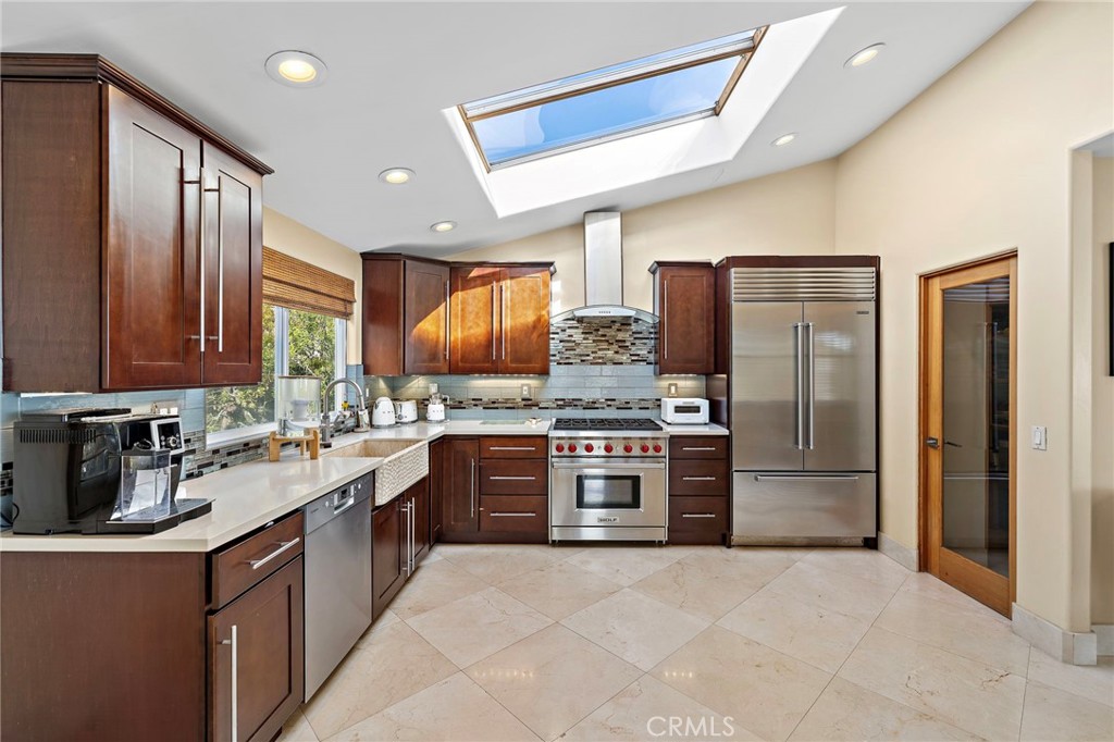 gourmet kitchen with 6- burner Wolf range and Sub-Zero refrigerator - 608 Loretta Drive, Laguna Beach CA 92651 - photo 23