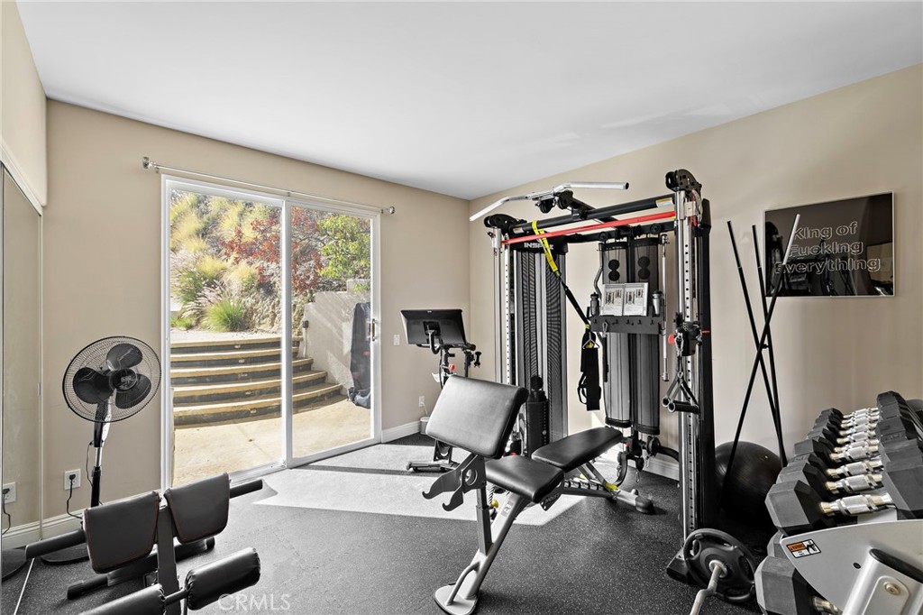 bedroom suite #2 with actual view of gym equipment - 608 Loretta Drive, Laguna Beach CA 92651 - photo 35