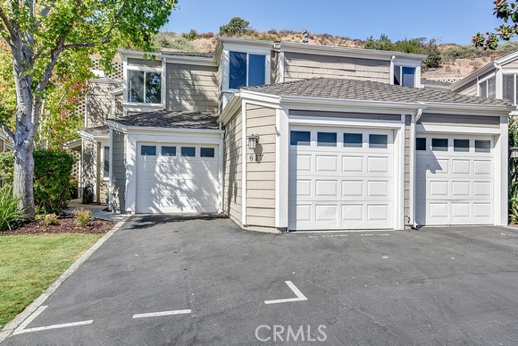 Welcome home! This unit has a 2 car garage AND two exterior parking spots. (Not all units have an attached garage or a d - 617 San Nicholas Court 617, Laguna Beach CA 92651 - photo 1