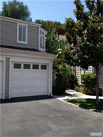 Remodeled Exterior with 2 parking spaces, one in front of attached garage and another in front of detached garage - 620 SAN NICHOLAS Circle 620, Laguna Beach CA 92651 - photo 1