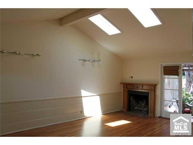 Light and bright with skylights, high ceilings, hardwood floors and fireplace~ - 644 Glenneyre Street B, Laguna Beach CA 92651 - photo 1