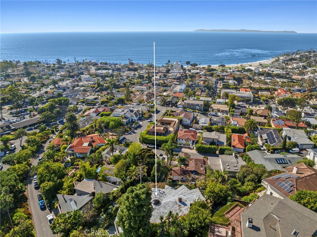 Offering remarkable privacy, the home spans approximately 3,073 square feet with four bedrooms and three baths, and is s - 660 Virginia Park, Laguna Beach CA 92651 - photo 4
