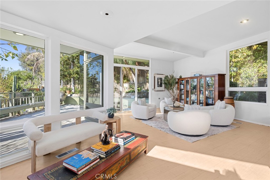 The main level is designed for both relaxed living and effortless entertaining, featuring a dramatic living room with va - 660 Virginia Park, Laguna Beach CA 92651 - photo 11