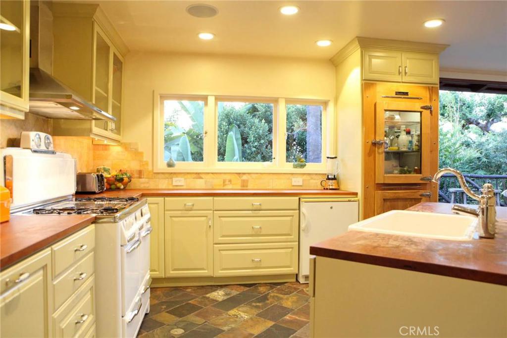 Vintage kitchen all new from 2009. Teak counters, African slate floors. Freezer Refrigerator. Shaw sink, instahot water - 663 Anita Street, Laguna Beach CA 92651 - photo 1