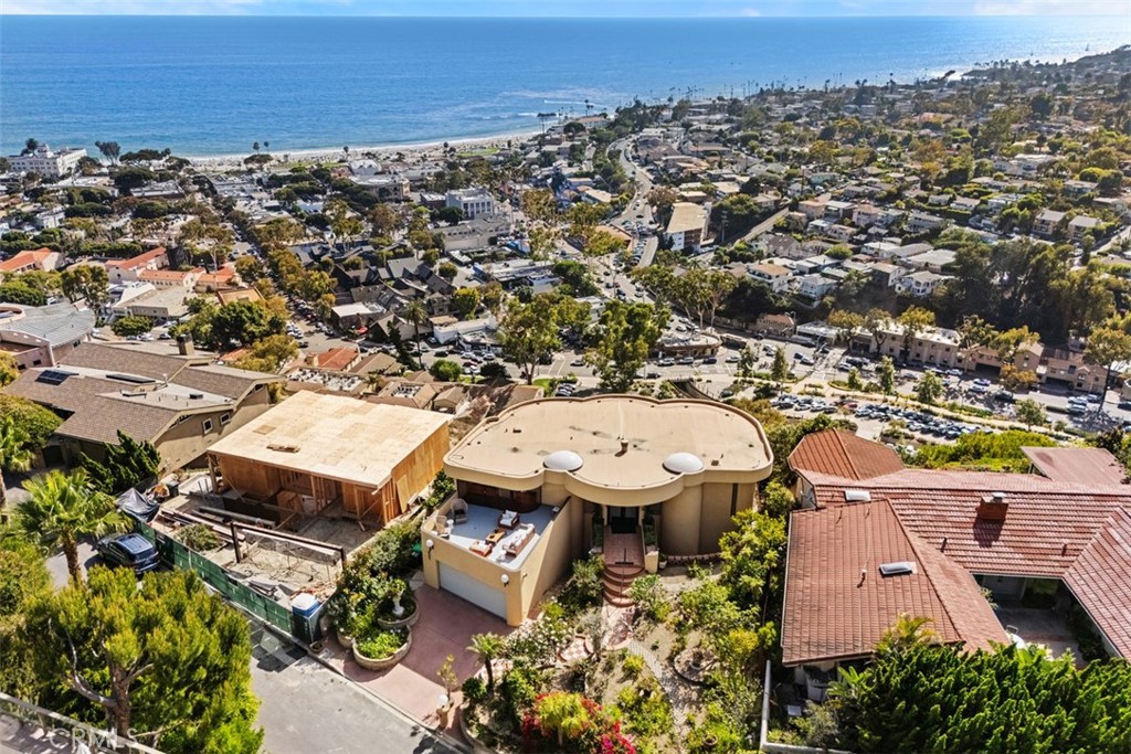 House has a newer roof, skylights. House on left is under construction, estimated finish by end of 2026. - 664 Mystic View, Laguna Beach CA 92651 - photo 12