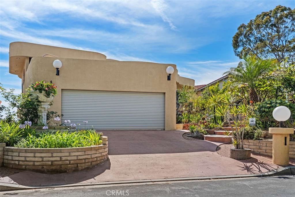 Driveway had planter added so only one car fits on driveway, could be modified to widen parking spaces. - 664 Mystic View, Laguna Beach CA 92651 - photo 14