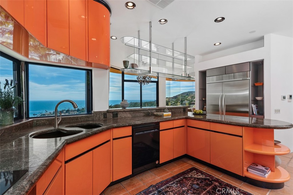 Kitchen is colorful and practical, many laminate cabinets most with built-ins and pull-outs. - 664 Mystic View, Laguna Beach CA 92651 - photo 26