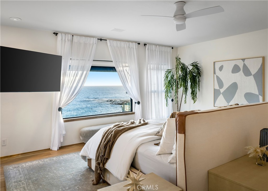 Privacy and ocean views in the primary bedroom - 675 Cliff Drive, Laguna Beach CA 92651 - photo 15