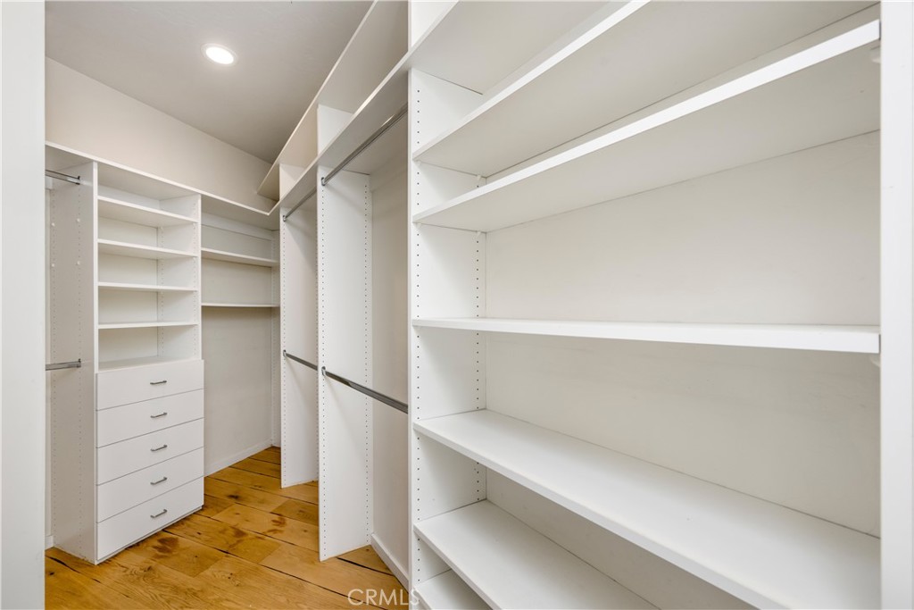 Built out primary closet - 675 Cliff Drive, Laguna Beach CA 92651 - photo 19