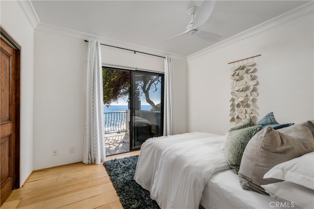 Lower level bedroom with access to the exterior - 675 Cliff Drive, Laguna Beach CA 92651 - photo 28
