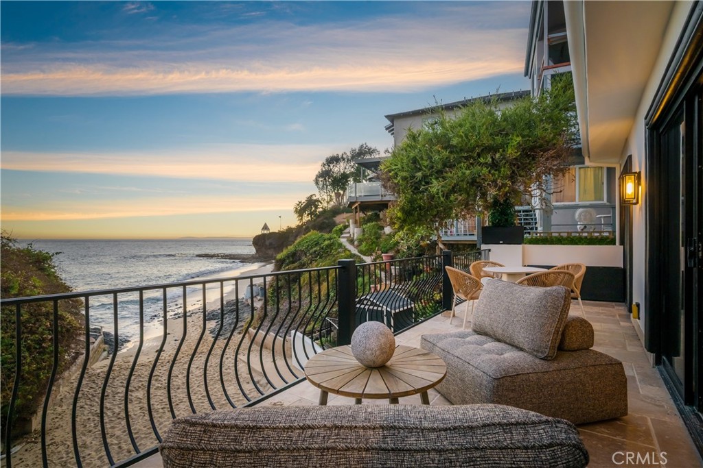 Upper level deck with Fisherman's Cove below - 675 Cliff Drive, Laguna Beach CA 92651 - photo 45