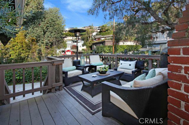 Enclosed front porch perfect for entertaining and relaxing. - 705 Saint Anns Drive, Laguna Beach CA 92651 - photo 1