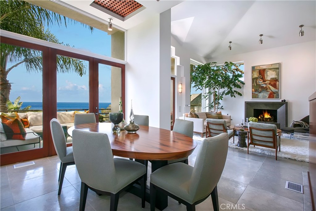 Ocean view dining room with attached outdoor patio. The open floor plan enjoys sweeping views from the living room, dini - 728 Rembrandt Drive, Laguna Beach CA 92651 - photo 1