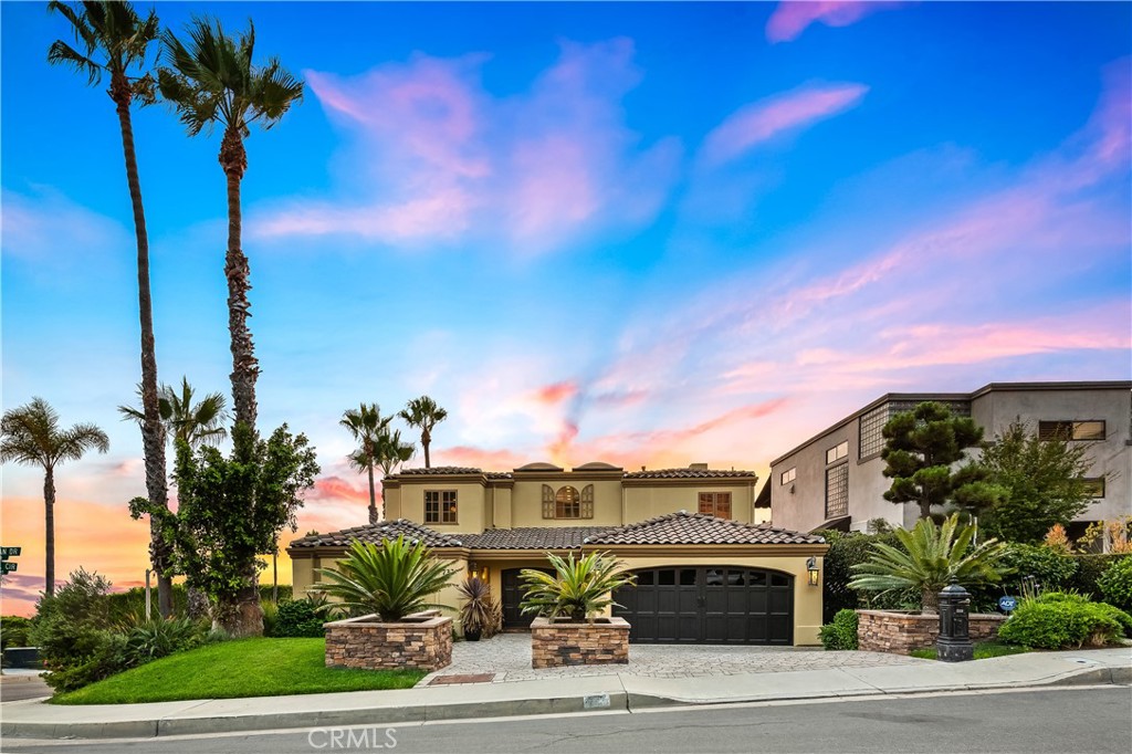733 Pelican Drive is located on a flat corner lot in the Idyllic Portafina area of Laguna Beach. - 733 Pelican Drive, Laguna Beach CA 92651 - photo 1