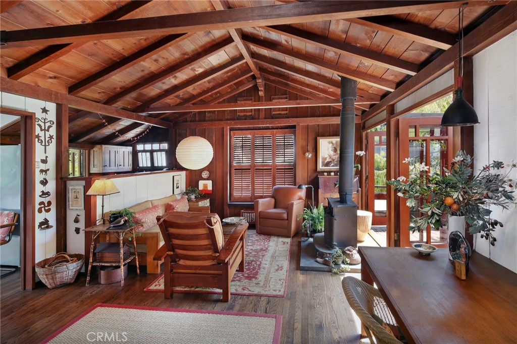 Spacious living room with high pitched ceilings opens onto an inviting deck. - 740 Browncroft Road, Laguna Beach CA 92651 - photo 1