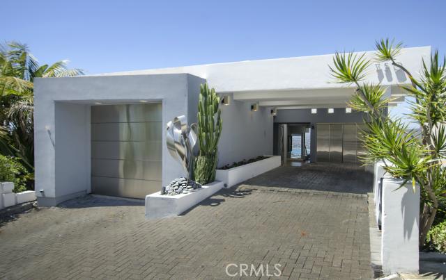 Contemporary exterior with stainless steel entry and garage door. - 750 Alta Vista Way, Laguna Beach CA 92651 - photo 1