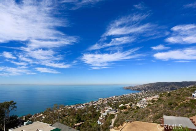 Panoramic ocean, canyon, and city view from living room, dining room, outdoor veranda, and Master suite. - 750 Alta Vista Way, Laguna Beach CA 92651 - photo 1