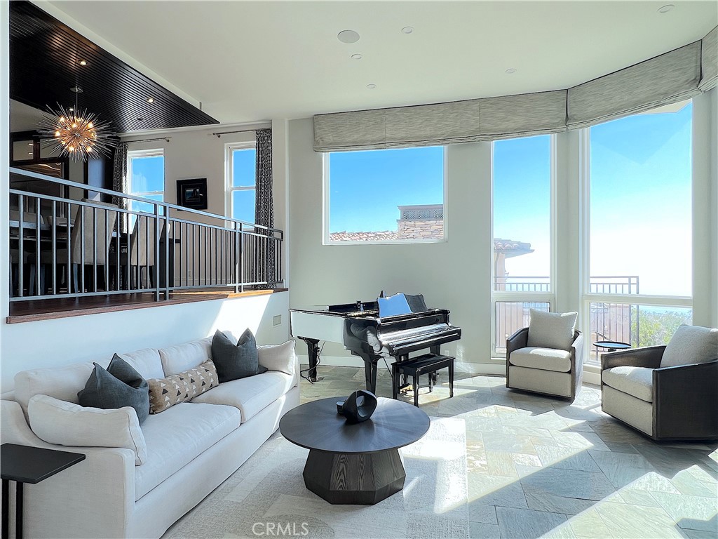 Living room to the right of the main entrance with amazing ocean view. - 750 Bolsana Drive, Laguna Beach CA 92651 - photo 20