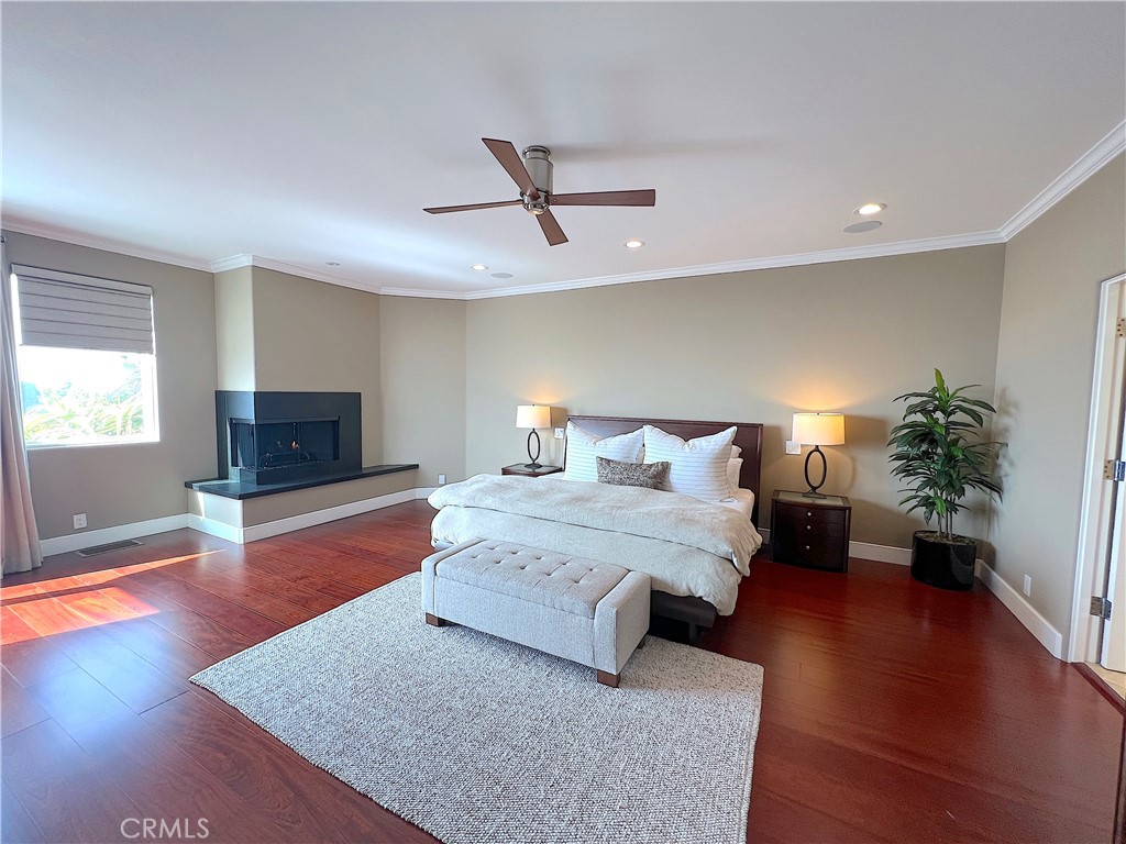 Light filled room with gas fireplace. - 750 Bolsana Drive, Laguna Beach CA 92651 - photo 32