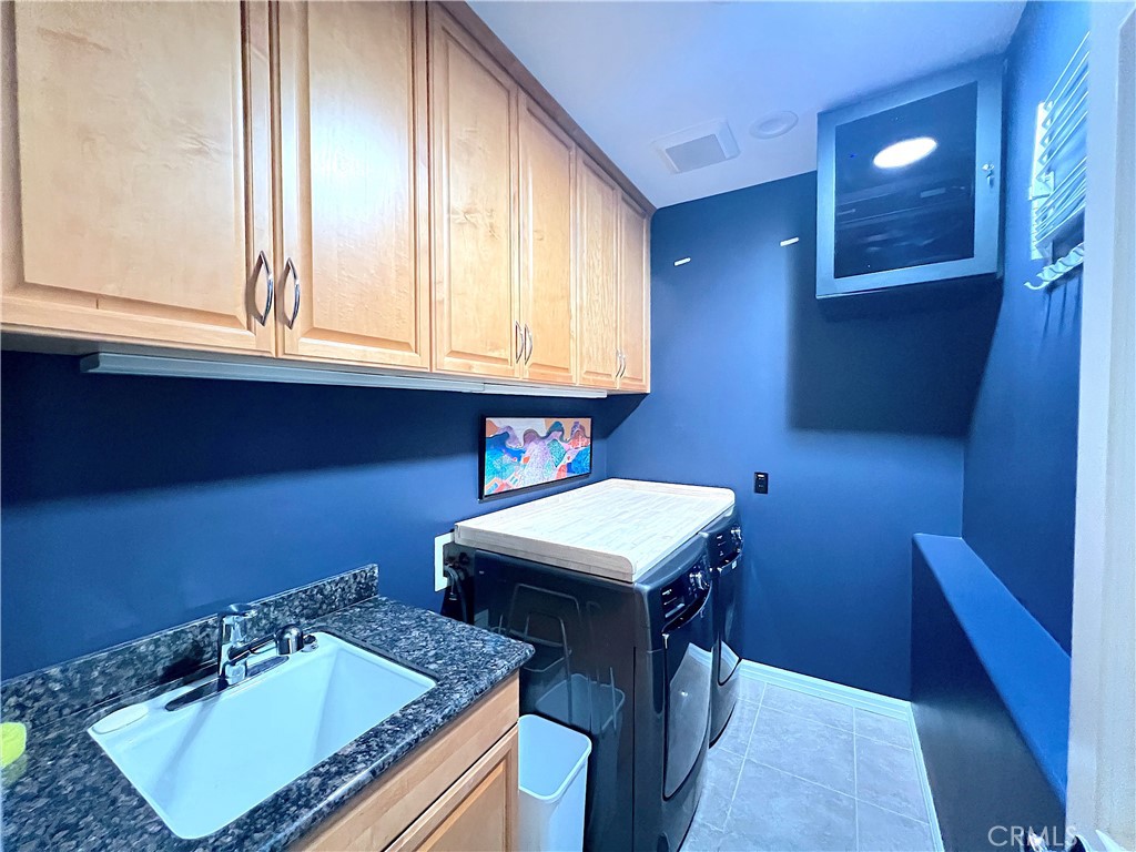 Laundry room conveniently located by the bedrooms. - 750 Bolsana Drive, Laguna Beach CA 92651 - photo 44