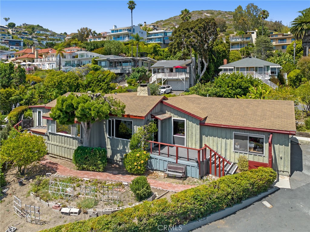 Two bedrooms and two baths are showcased in the single-level plan, which extends approximately 1,729 square feet. - 790 Manzanita Drive, Laguna Beach CA 92651 - photo 1
