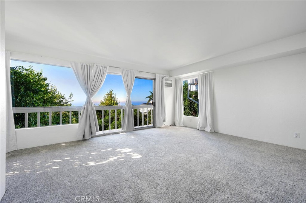 Primary bedroom with ocean views and a new deck to enjoy. - 815 La Mirada Street, Laguna Beach CA 92651 - photo 24
