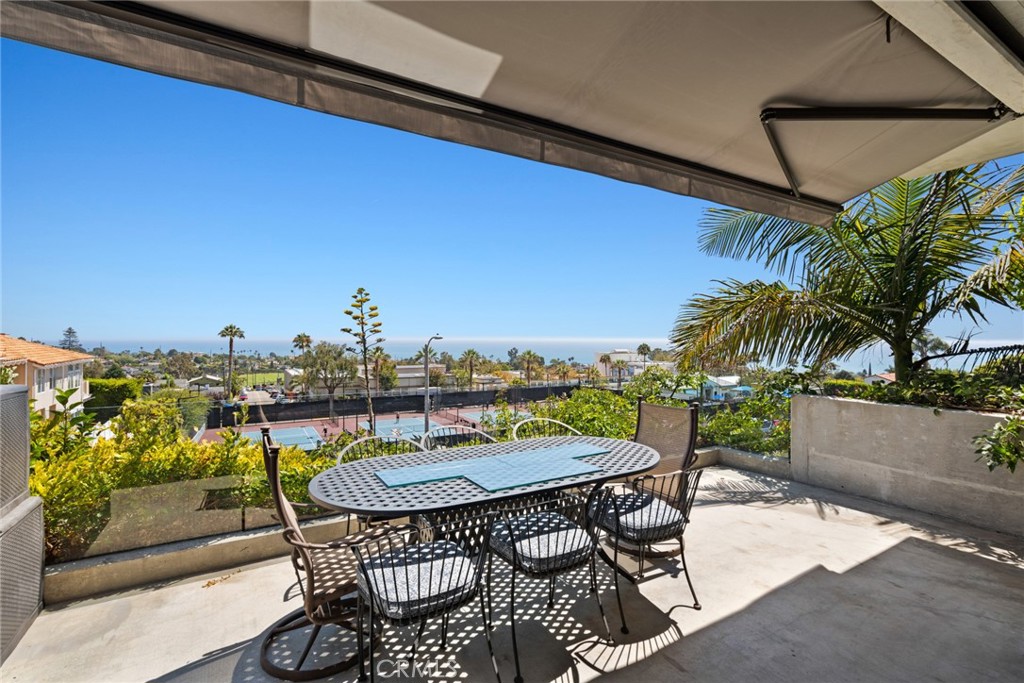 Dine al fresco on the ocean view deck adjoining the living room. - 816 Manzanita, Laguna Beach CA 92651 - photo 1
