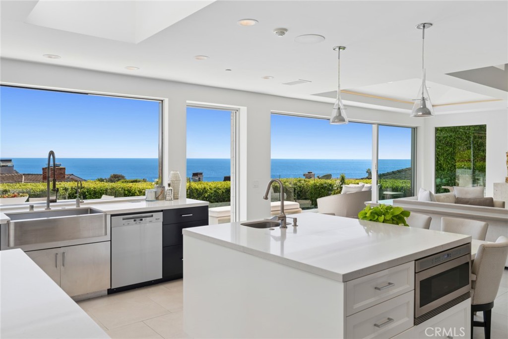 A suite of premium Wolf, Miele and Sub-Zero appliances, including a six-burner cooktop, dual ovens and dual dishwashers, - 820 Emerald Bay, Laguna Beach CA 92651 - photo 7