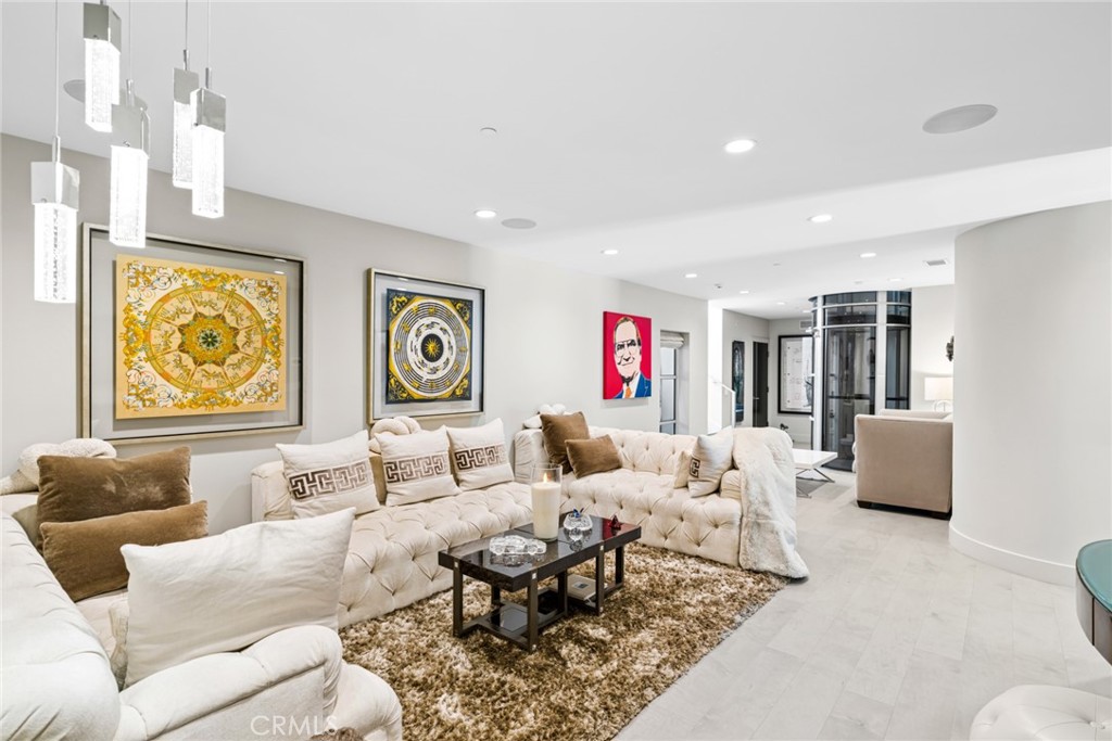 An elevator connects the home’s two levels, and an additional living room on the lower level creates a versatile space f - 820 Emerald Bay, Laguna Beach CA 92651 - photo 29