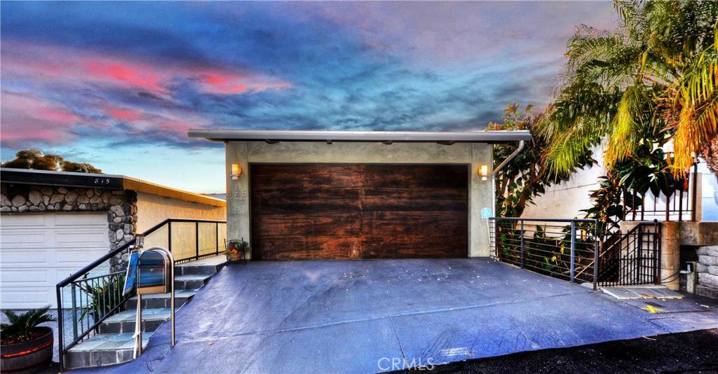 Not only a two car garage, but two full parking spaces in front of garage. - 825 Katella Street, Laguna Beach CA 92651 - photo 1