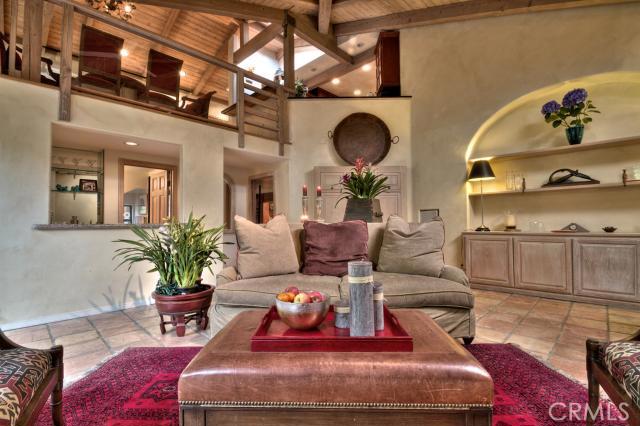 This is the downstairs living space located on the lower level of the home. To the left is the bar and behind that is a - 844 Bluebird Canyon Drive, Laguna Beach CA 92651 - photo 1