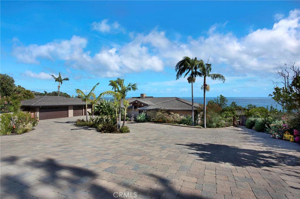 Set on almost an acre - huge driveway with ample guest parking leads to the entry of this beautiful and unique home. - 9 Vista Del Sol, Laguna Beach CA 92651 - photo 1