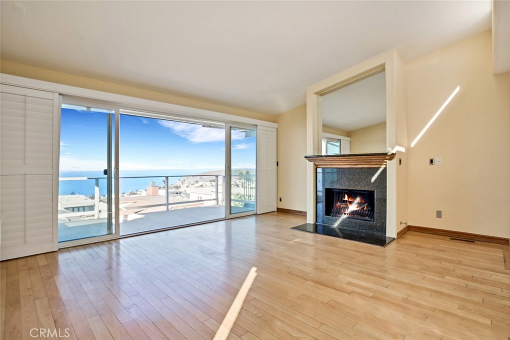 enjoy the sit down ocean views from the comfort of your living room, with the fireplace on - 911 Santa Ana Street, Laguna Beach CA 92651 - photo 1