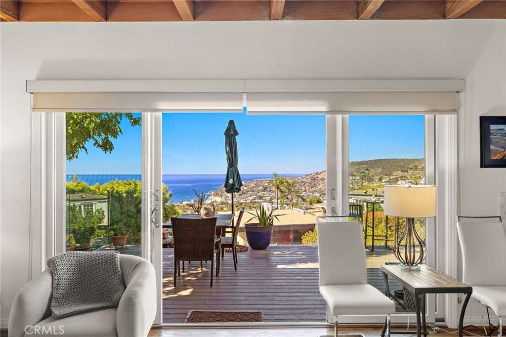 Living room with ocean view - 930 Canyon View Drive, Laguna Beach CA 92651 - photo 12