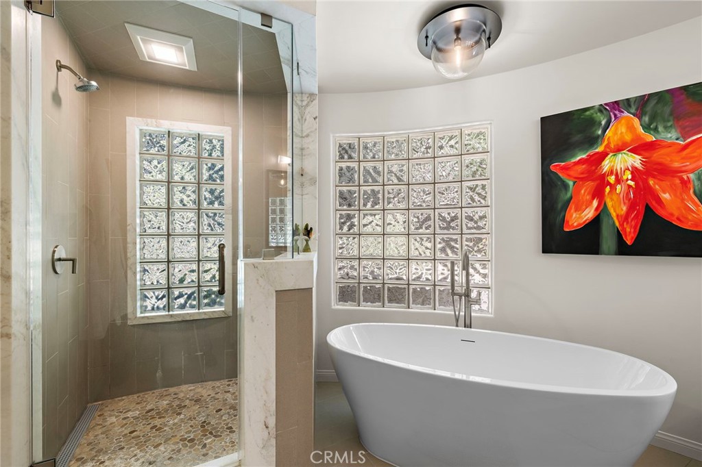 Primary bathroom with shower and soaking tub - 930 Canyon View Drive, Laguna Beach CA 92651 - photo 23